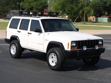 New ProComp fogs and all flares repainted.  Scored two sets of Jeep Ravine wheels, so I have extras and now have a full-size spare in the back.