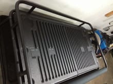 Cargo carrier top cut from tailgate portion of truck bed liner