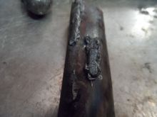 I tapped it with a hammer and it came right off. The welder must have been set to bubblegum settings. extra cold/no penetration