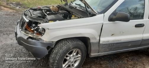 A bit of a buckle in the fender.  It's binding on the door.