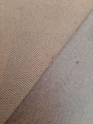 There are two different textures on the hardboard, coarse and smooth. I plan on mounting the rough side towards the door panel so the adhesive will have a more mechanical lock. The smooth side towards the door will make sure it fits completely flat and will have the most surface area.