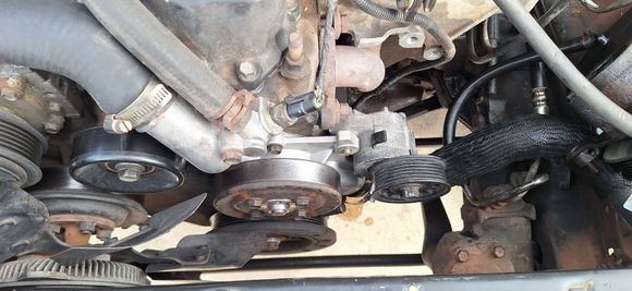 Chevy 5.3l Belt tensioner mounted to water pump with modification.