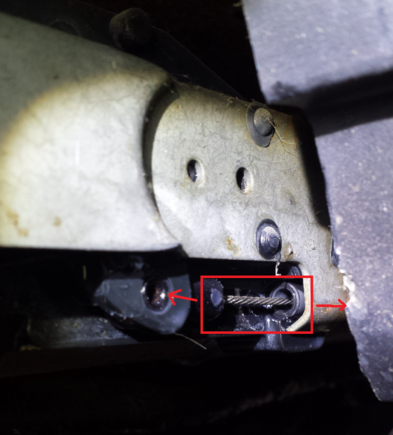 I noticed it was attached to this cable, and when I pushed the pivoting mechanism attached to this down, I heard a clicking under my shifter cover.