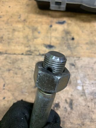Then cleanup and chamfer the end. Use the spare nut to clean up the threads again.