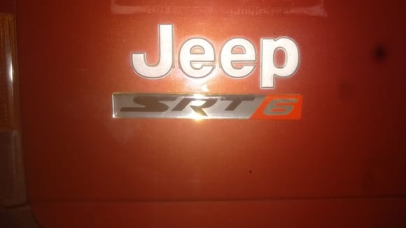 Sorry for the bad picture bad lighting in the garage, but here is the SRT6 badges, pretty cool I think, Ill have one here on the trunk and then one on each side where it under the  cherokee decal.