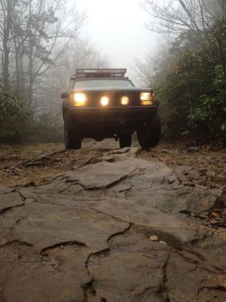 rocky path

1993 Jeep cherokee with Bushwacker cutout fenders, 3" lift, 1" spidertrax adapters, rubicon wheels, yakima roof rack, rotopax mounts, hela lights