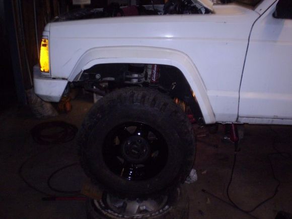 took some stock steel jeep wheels and hammerite painted them bolted the centers back on and got some 31x10.50's w/about 75%tread off craigslist for 200$