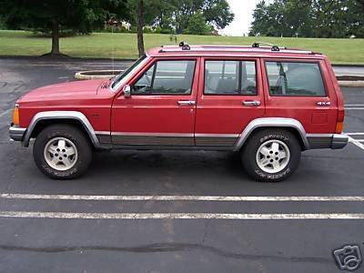 Cherokee driver's side has a dent-ebay pic