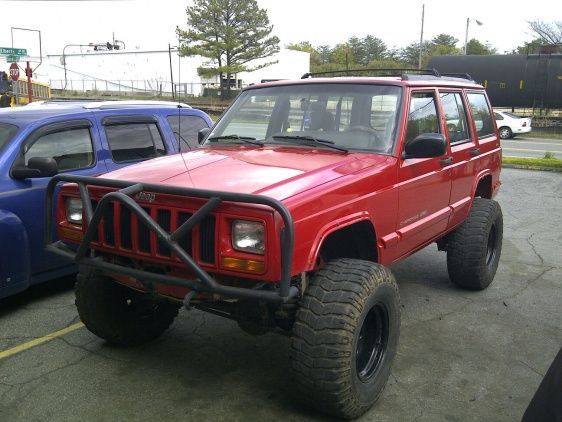 5 inch lift on 33's on black aluminum bullet hole rims