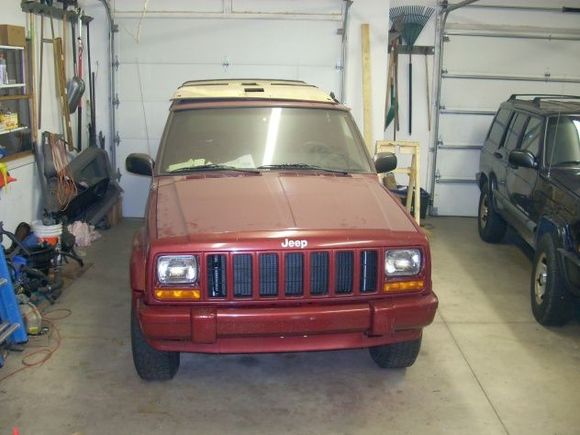 Put front end back together. New Radiator and AC Condensor. Now have to transfer entire interior from 1999! Need a car wash and paint job! Headliner shown on roof. Need that to trace holes on 1999 headliner for overhead console to fit out of 1998.