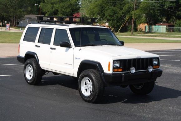 New ProComp fogs and all flares repainted.  Scored two sets of Jeep Ravine wheels, so I have extras and now have a full-size spare in the back.
