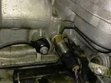 Oil pressure sensor above the starter, I don’t believe this photo to be an LNF engine