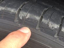 The other side. Yup a rub. But only with a passenger in the rear seat 
