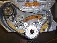 It applies pressure to the pivot in the tensioner guide, it is not one of those shouldered bolts, just a bolt.
The replacement should be easy to locate at your GM dealership, or online