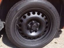 Center cap cut from Malibu wheel cover painted flat black matched wheels. $20 for 4 economy upgrade?