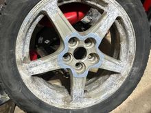 Aluminium Pontiac G6 rims lurking underneath those plastic fantastic caps.