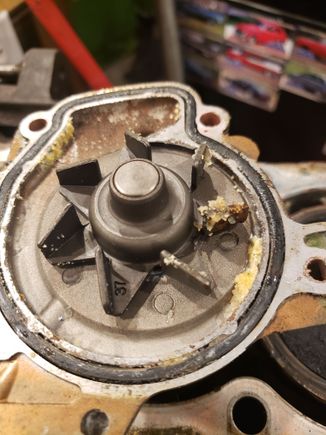 Water pump has gunk built up on the impellers.