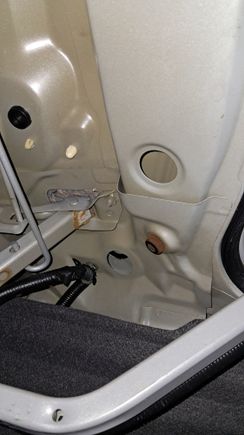 Pic taken inside trunk from entering back seat. Can see water drop coming from square by hinge.
