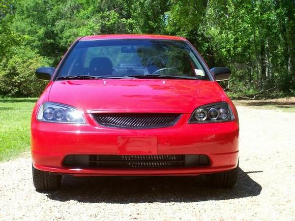 BLACK MESS GRILL AND BLACK HALO PROJECTOR HEADLIGHTS