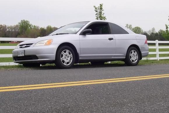 Side picture of my car with the first modification of added window tint at 20% all the way around with a tint strip as well