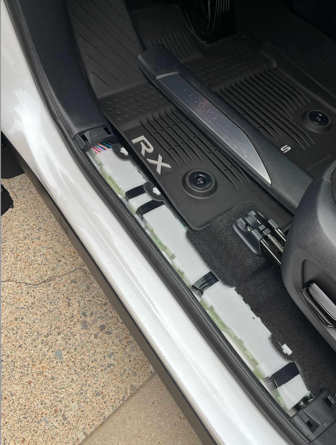 Underneath driver side sill - no tools just popped clips with hands to remove old door sill. Takes a little bit of force but be careful not to go too hard. I did hold the adjacent covers down with my other hand while pulling up on the part. 