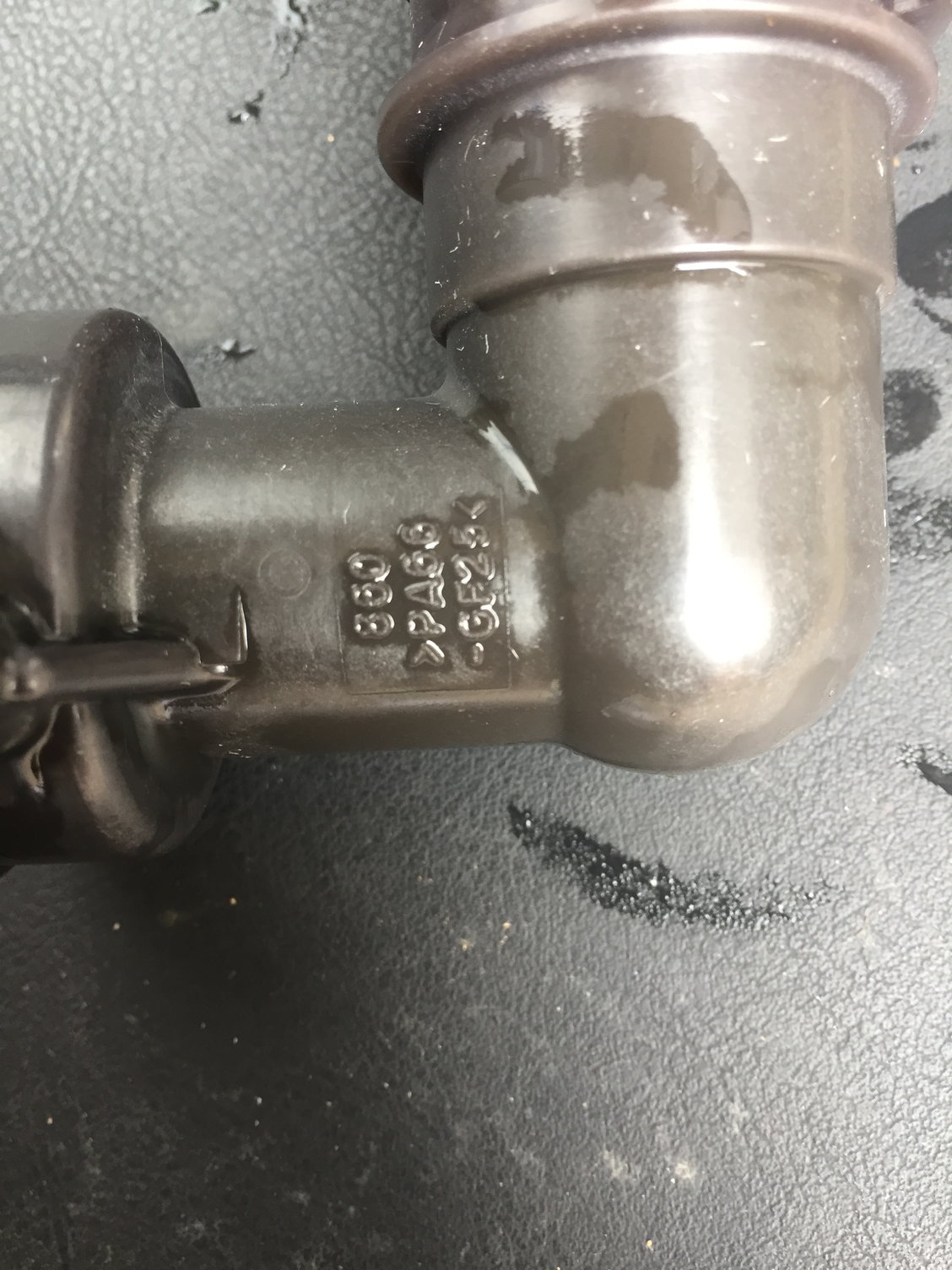 Radiator coolant filler neck leak - is this coupling a factory part