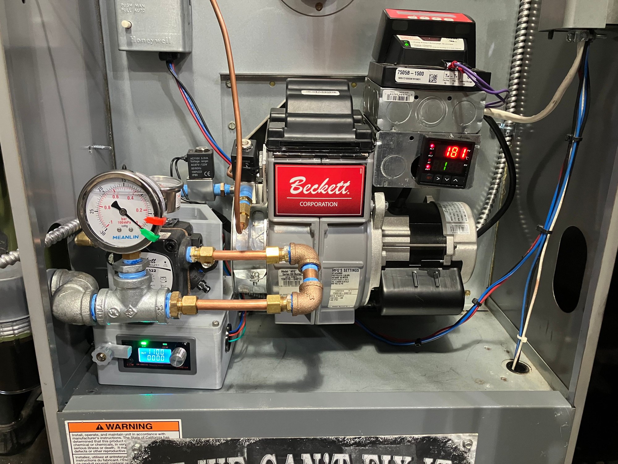Positive displacement oil pump, fully adjustable and serviceable, full automatic control with programmable everything including pre-heat and all delays. All OTS parts to ensure infinite operation span. Currently getting about 80k BTU at .5-.75 gallons of used oil per hour, exhaust is extremely clean and the new draft control works perfectly 