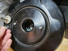 Passenger-side stud (left) sheared off, driver-side stud (right) missing a nut.  