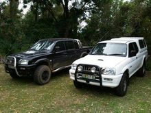 White is 2.8 diesel and the black one is a 1UZFE