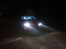 The HID conversion is much superior than factory LED. The HID got a lot more "penetrating power" than LED, and if you aim lower it won't annoy incoming traffic.