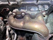 Front exhaust manifold near the oil filter. 