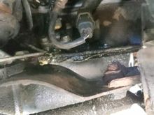 Here is a another angle. That disgrace of an oil pan, is what convinces me its the issue.  But then again there seems to be a damp area above the seem so i am unsure.