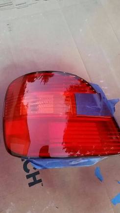 I masked the reverse lights and applied a coat of VHT Red after wet sanding, clearing the tailights and using alcohol to clean it further.