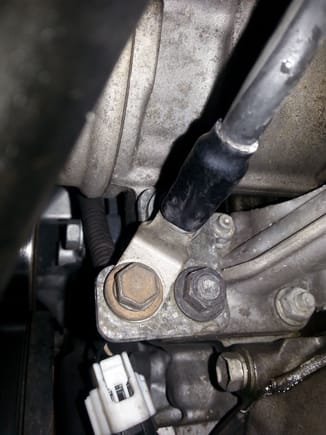 Main negative battery cable terminates at the AC  Compressor and Oil filter housing bracket.. Lexus uses a plated metal compressor stay. The original on this 99 LS400 is tired.