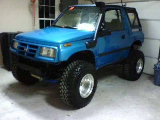 He had a 1996 Geo Tracker 4x4 5 speed with a white soft top.  It was fun.