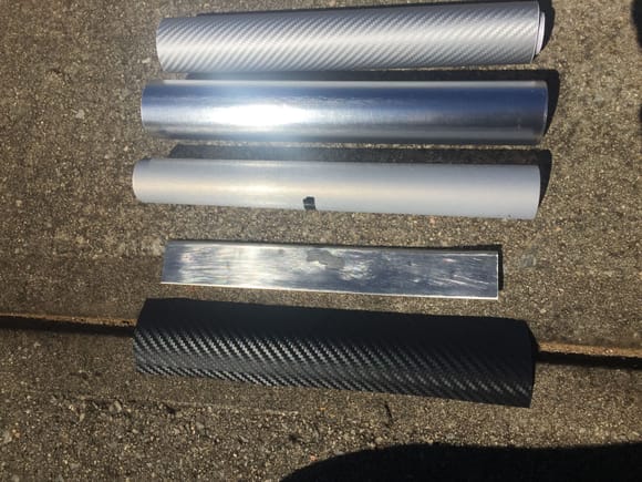 All purchased wraps. Top to bottom is Taro Works 3d Carbon Fiber, VVID Silver Brushed Chrome, 3M 1080 Series Brushed Aluminum (not a good color choice) and what I used Black 3M DI-NOC Carbon Fiber