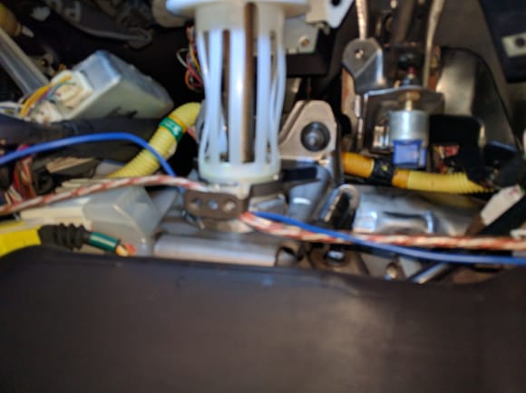 Just when you think you have all of the bolts removed, look way up past the steering column through a marsh of wires and hoses and there are more!