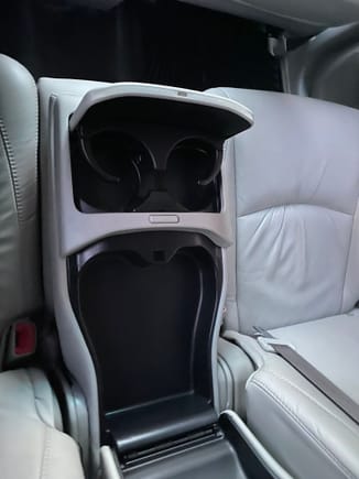 rear fold down storage and cup holders