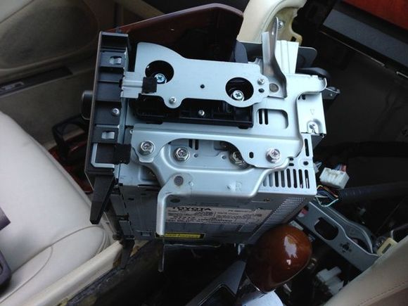 Side view of original head unit with door attached removed from dash.