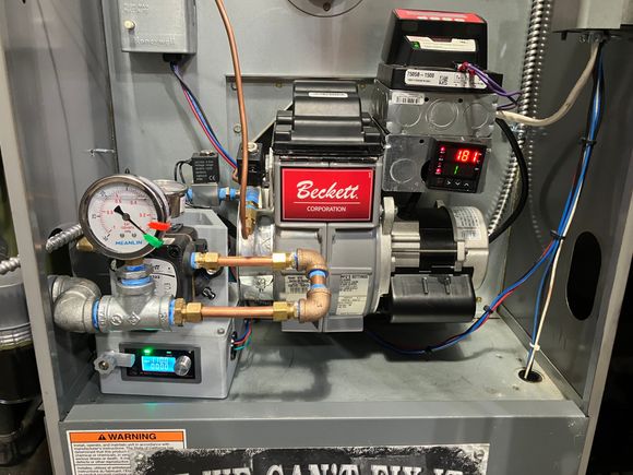 Positive displacement oil pump, fully adjustable and serviceable, full automatic control with programmable everything including pre-heat and all delays. All OTS parts to ensure infinite operation span. Currently getting about 80k BTU at .5-.75 gallons of used oil per hour, exhaust is extremely clean and the new draft control works perfectly 