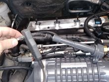 In order to use a timing light I borrowed I hacked off the rubber boot on an old lead so I could stick it in the coil and have it make contact. 