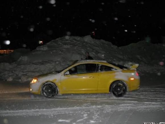 mike and my car next to a snow mound