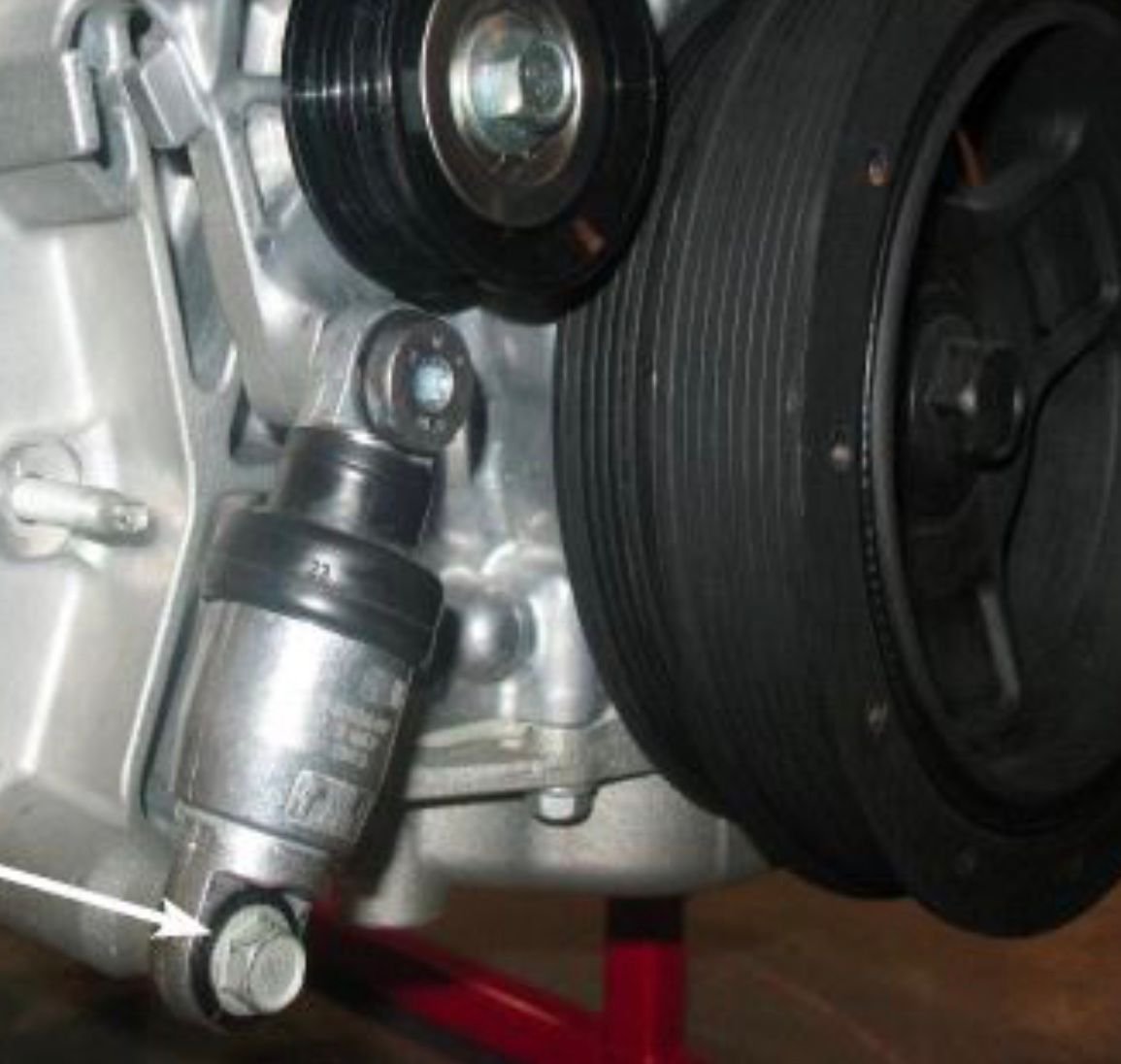 Is a leaking Drive Belt Tensioner Assembly Covered under GM Extended