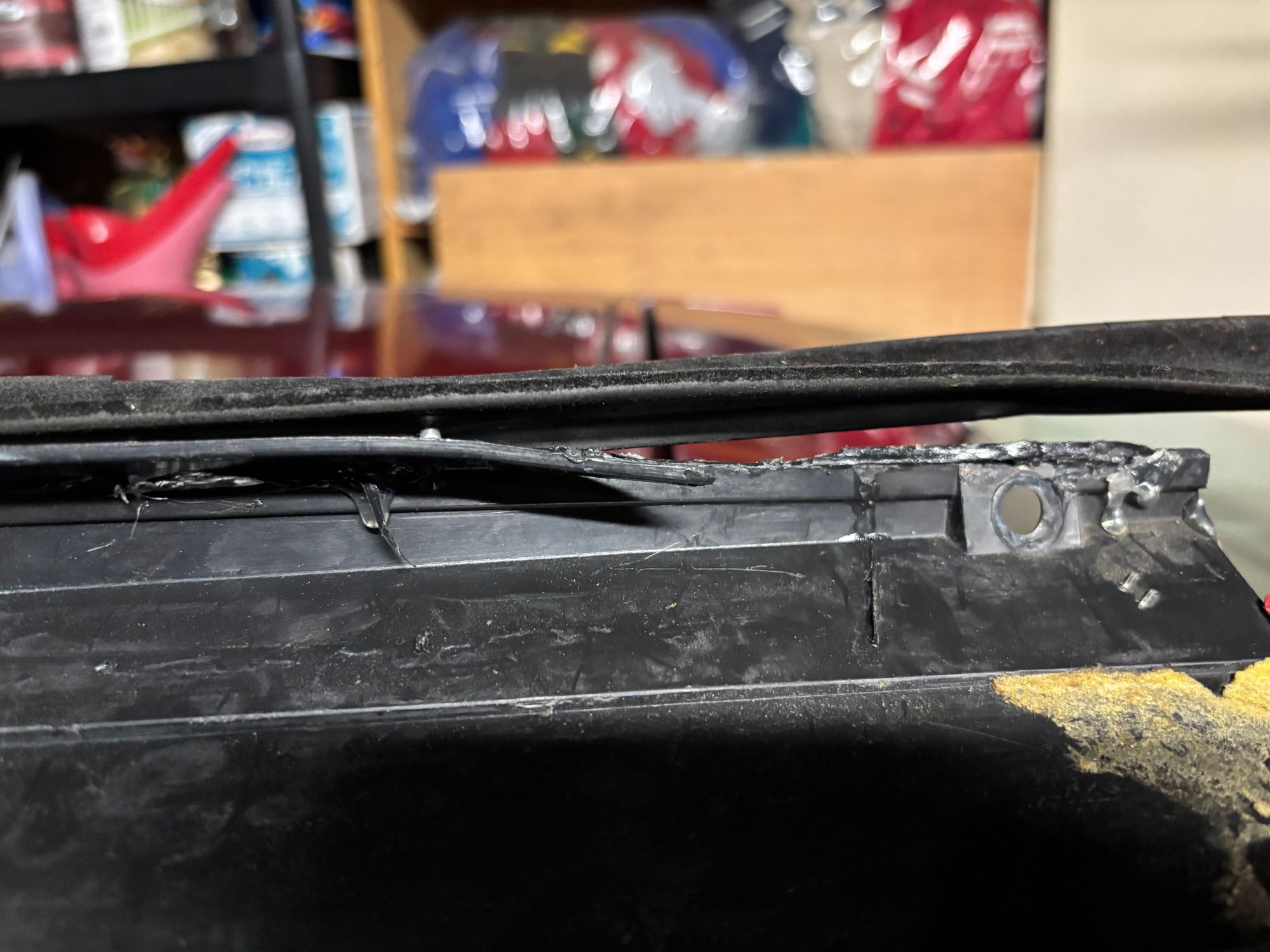 More broken plastic. The new panel had a metal strip instead. It fit well.