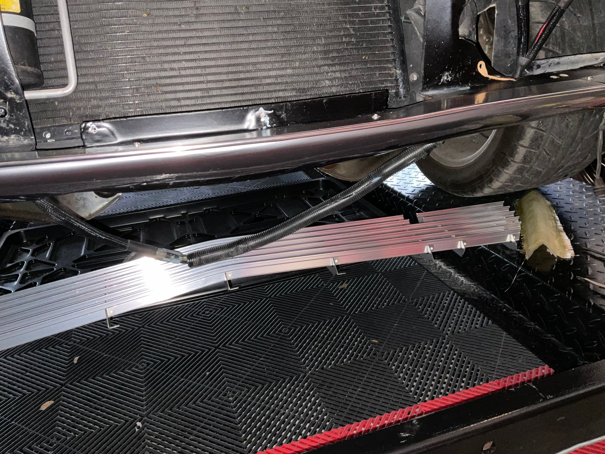 The grill surround on 63/64 models hides the valance seam.