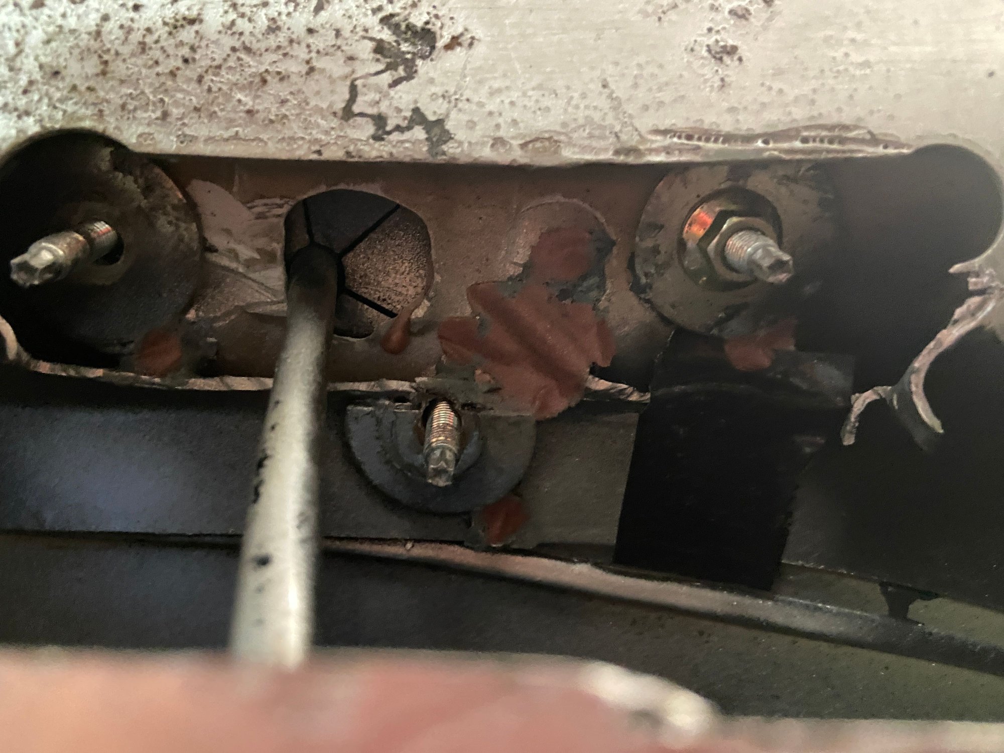 I had to cut away some of the metal to get the nuts threaded.  You can see the 3rd stud that misses the metal.  I just put a fender washer on it