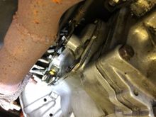 The sensor has a brass base and it’s right of the exhaust 