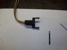 I use a piece of flat metal as a tool
Scrap that I saved from something??? About 1/8" wide and .010" thick.