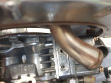 Hitting float adjustment screws.