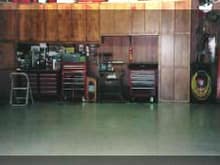 Floor in 2000.  Lowes commercial 1/8 inch thick tile.  Just cleaned floor with soap and water and used a high quality adhesive.